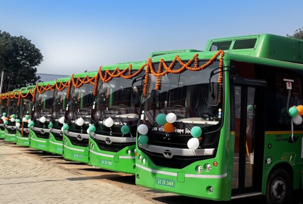 A fleet of green coloured electric buses in Guwahati, India