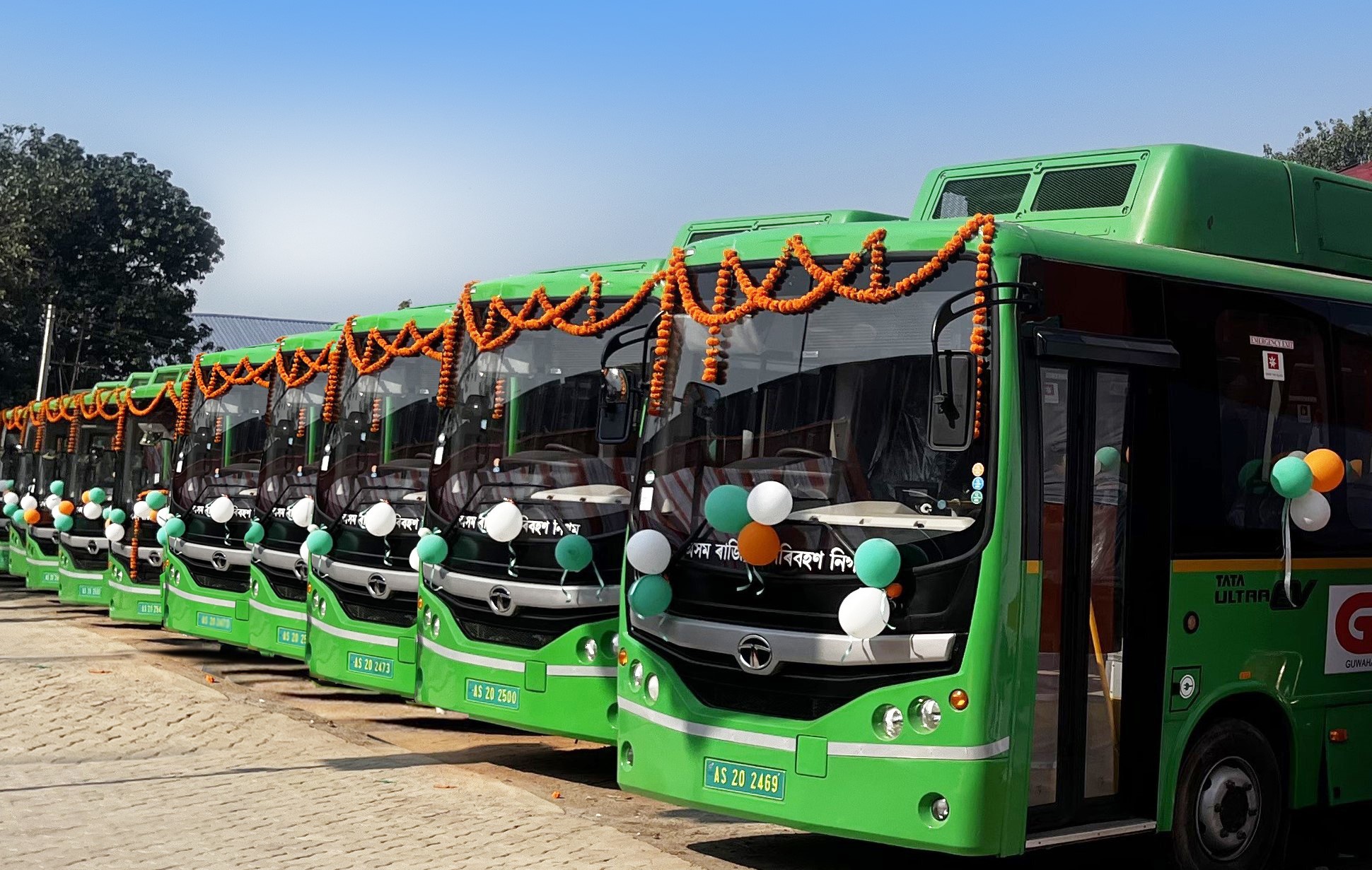 A fleet of green coloured electric buses in Guwahati, India