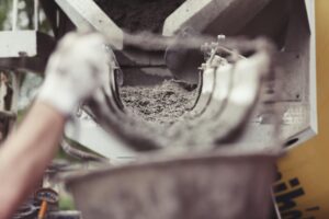Concrete flowing at a construction site. Photo: Pexels/Life of Pix